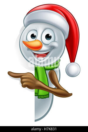 A happy Christmas peeking snowman cartoon character pointing Stock Photo