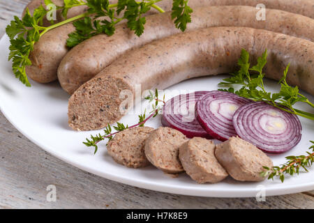 Homemade white pudding in sausages forms prepared by hungarian butcher. Stock Photo