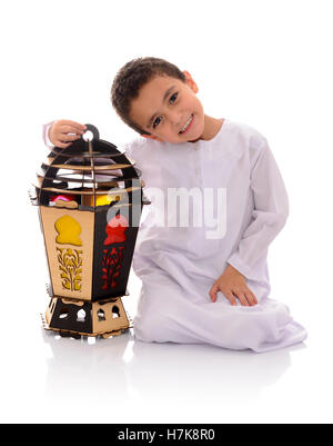 Happy Young Boy with Big Lantern Celebrating Ramadan Isolated on White Background Stock Photo