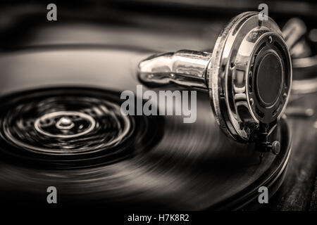 Gramophone playing old disk, old days music, in Sepia Tones, close up shot Stock Photo