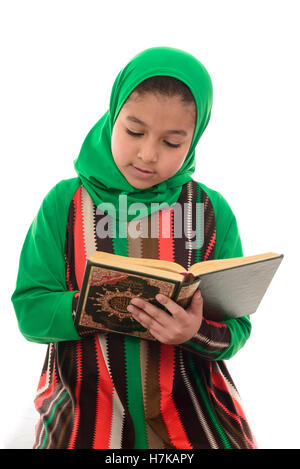 Little Young Muslim Girl Reading Holy Quran Isolated on White Background Stock Photo