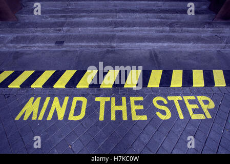 mind the step hazard warning sign Stock Photo