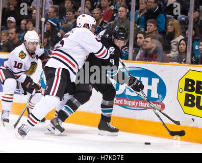 January 28, 2010; San Jose, CA, USA; Chicago Blackhawks defenseman Brent Sopel (5) checks San Jose Sharks center Joe Pavelski (8) during the third period at HP Pavilion. Chicago defeated San Jose 4-3 in overtime. Stock Photo