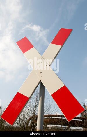 Crossing sign, saltire, at a level crossing, Landschaftspark Duisburg Nord landscape park, Ruhrgebiet area Stock Photo