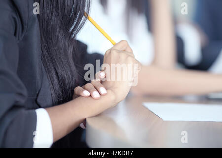 Close-up of Business people working together at meeting Stock Photo