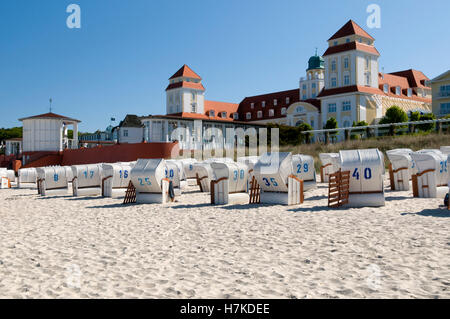 Roofed wicker beach chairs in front of Kurhaus, spa hotel in the Baltic Sea resort town of Binz, Isle of Ruegen Stock Photo