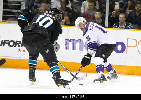 November 15, 2010; San Jose, CA, USA;  Los Angeles Kings center Brad Richardson (15) is defended by San Jose Sharks center Jamal Mayers (10) during the first period at HP Pavilion. Stock Photo