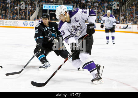 November 15, 2010; San Jose, CA, USA;  Los Angeles Kings right wing Dustin Brown (23) is defended by San Jose Sharks center Joe Thornton (19) during the second period at HP Pavilion. Stock Photo