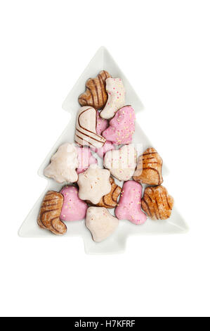 Lebkuchen, German spiced biscuits in a Christmas tree shaped dish isolated against white Stock Photo