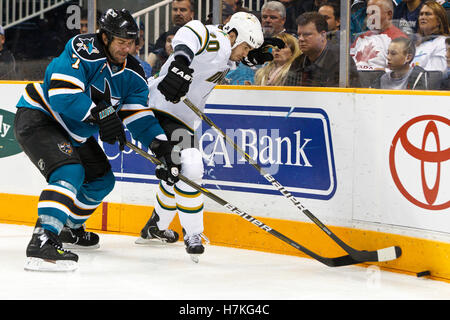 March 5, 2011; San Jose, CA, USA;  San Jose Sharks defenseman Niclas Wallin (7) knocks the puck away from Dallas Stars center Brian Sutherby (20) during the third period at HP Pavilion.  Dallas defeated San Jose 3-2. Stock Photo