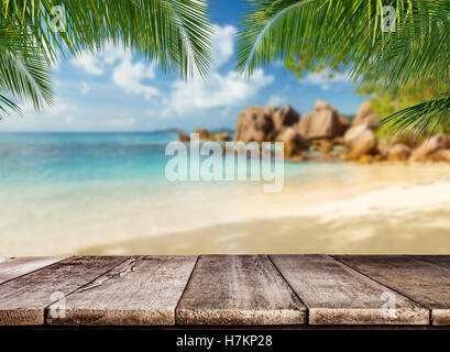 Empty wooden planks with tropical beach on background. Ideal for product placement Stock Photo