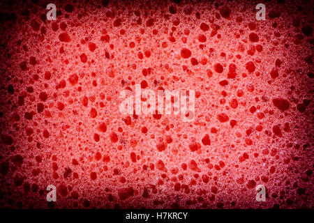Red sponge texture background. Close up. Stock Photo