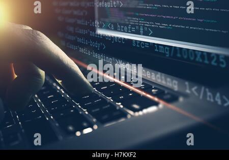 Web Development Work Concept. HTML CSS Programming Job. Programmer Working on His Laptop Computer Concept. Stock Photo