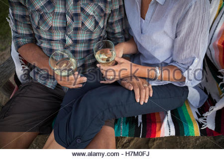Retired couple drinking white wine