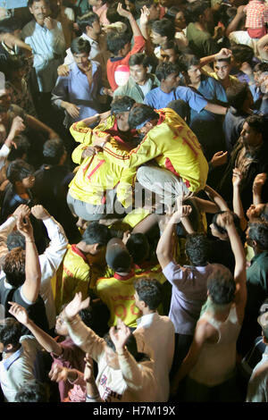 People celebrating ‘Dahi Handi’ a Hindus festival during July to celebrate the birthday of Lord Krishna Stock Photo