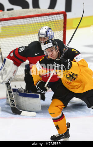 Augsburg, Germany. 6th Nov, 2016. Germany's Jerome Flaake and Canada's goalie Danny Taylor in action during the Germany Cup ice hockey match between Germany and Canada in Augsburg, Germany, 6 November 2016. PHOTO: KARL-JOSEF HILDENBRAND/dpa/Alamy Live News Stock Photo