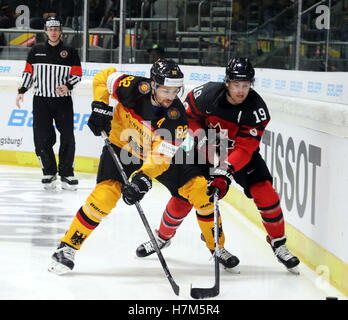 Augsburg, Bavaria, Germany. 6th Nov, 2016. from left Sinan AKDAG (Germany/Mannheim), Brandon BUCK (Canada/Ingolstadt), .Ice Hockey Deutschland Cup, team Canada vs team Germany, Augsburg, Curt-Frenzel-Eisstadion, November 06, 2016, every November takes place as preparation for the IIHF World Championship the Hockey Deutschland Cup with 4 teams including one team from North America. Team Canada consists from players playing in Europe. Credit:  Wolfgang Fehrmann/ZUMA Wire/Alamy Live News Stock Photo