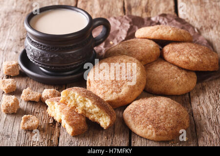 Tasty American cookies Snickerdoodle and coffee with milk close-up on the table. horizontal, rustic style Stock Photo