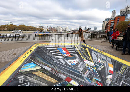 To mark one of the most controversial US election campaigns in modern history Sky News has commissioned a 3D street art scene of Times Square, New York. The commission, created by street artist Joe Hill, will be positioned at Observation Point on LondonÃ¢Â€Â™s South Bank on Sunday 6th and Monday 7thNovember ahead of the US election on 8thNovember. Tourists and commuters will be able to enjoy the art and join in by standing on its edge looking down on a busy Times Square. Sky NewsÃ¢Â€Â™ election night coverage, America Decides, will be broadcast from a specially created studio on Times Square f Stock Photo