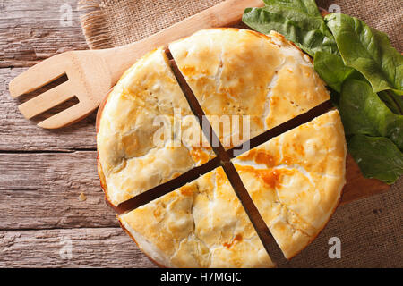 Tasty sliced Greek spanakopita pie close-up on the table. horizontal view from above Stock Photo