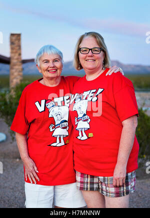 Two ladies wearing bright red 'Vote' Shirts Stock Photo