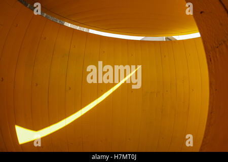 Brightly lit narrow yellow passage in a building near Waterloo station in London Stock Photo