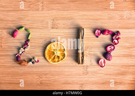 2017 written with spices on wooden background, food 2017 new year concept Stock Photo