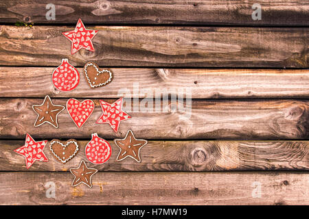 Christmas tree made of wooden rustic ornaments on wooden planks background Stock Photo