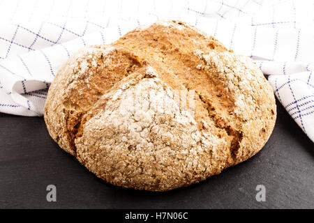 warm, freshly baked irish soda bread on slate Stock Photo