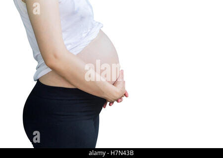 pregnant woman holding tummy on isolated white with clipping path. Stock Photo