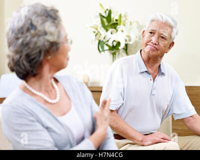 senior asian couple having a fight at home Stock Photo