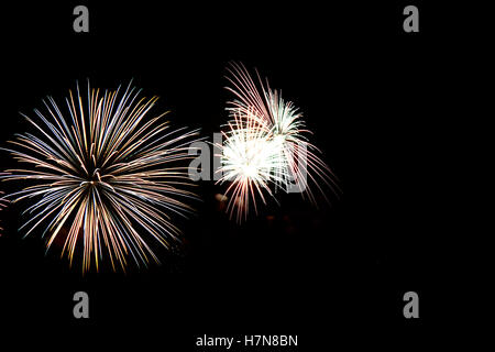 Colorful celebration fireworks isolated on black background. Stock Photo