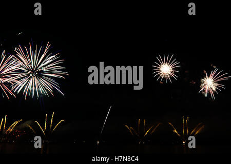 Colorful celebration fireworks isolated on black background. Stock Photo