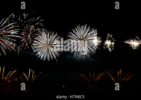 Colorful celebration fireworks isolated on black background. Stock Photo