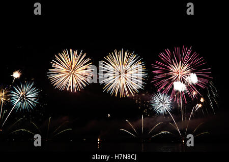 Colorful celebration fireworks isolated on black background. Stock Photo