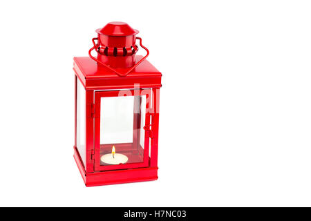 Red metal lantern with burning tealight isolated on white background Stock Photo