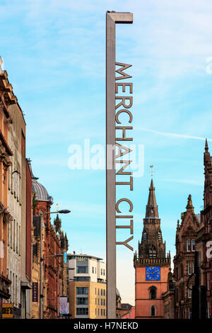 Sign at the entrance to the Merchant City district of Glasgow, on Argyll Street with the spire of the Tron Theatre,  Glasgow Stock Photo