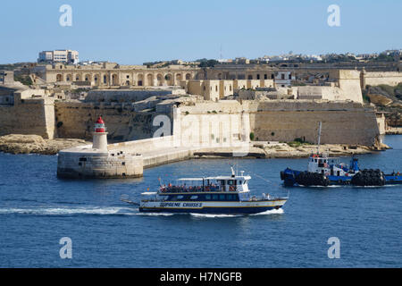 Valletta, walled capital city port of Malta. View from Fort St Elmo towards Birgu, with excursion boats in the harbour. Stock Photo