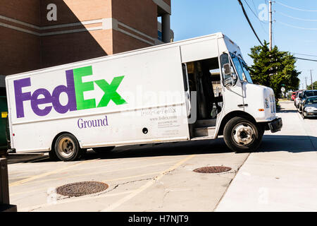 A FedEx ground delivery truck offloading at a loading dock. Oklahoma ...