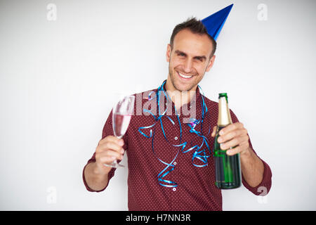 Man holding bottle and glass of champagne Stock Photo