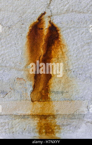 Stains of rust on the concrete surface. Stock Photo