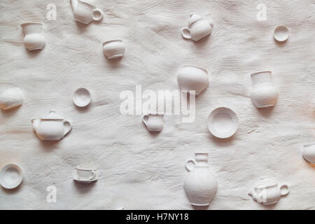 background ceramic dishes on the wall, interesting design solutions, design the walls of restaurants bars, an unusual background Stock Photo