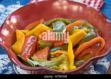 fried bell peppers of various colors cut in strips Stock Photo