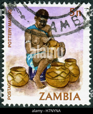 ZAMBIA - CIRCA 1981: A stamp printed in Zambia, is dedicated to Cultural Heritage, shows a Pottery Making, circa 1981 Stock Photo