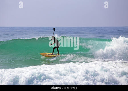 Stand up paddle boarding on the atlantic ocean Stock Photo