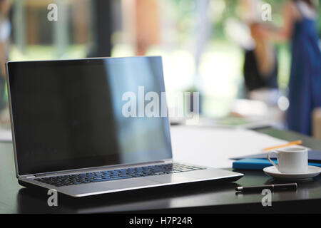 Office workplace with laptop and office supplies Stock Photo