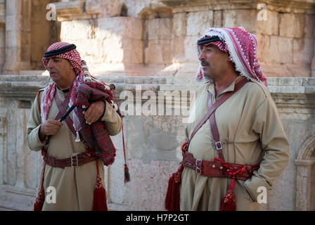 Close up of two bagpipe players at the Roman theater of Jerash Stock Photo