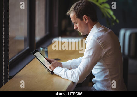 Businessman working on a digital tablet Stock Photo
