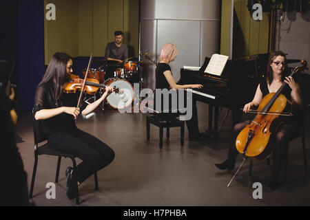 Group of students playing various instruments Stock Photo