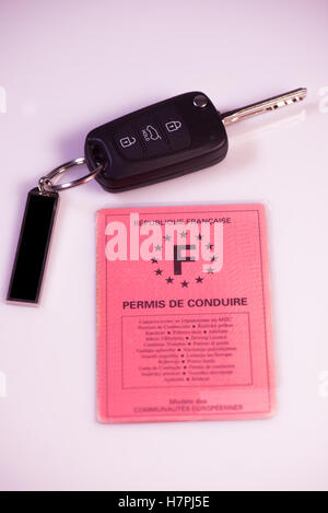Car keys and drivers license on white background, France Stock Photo
